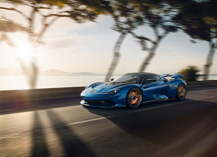 Blue Pininfarina Battista driving on a coastal road