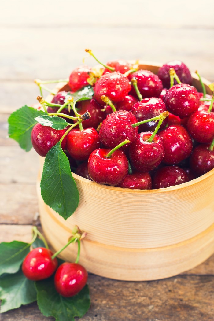 Fresh Cherries in a Wooden Bowl