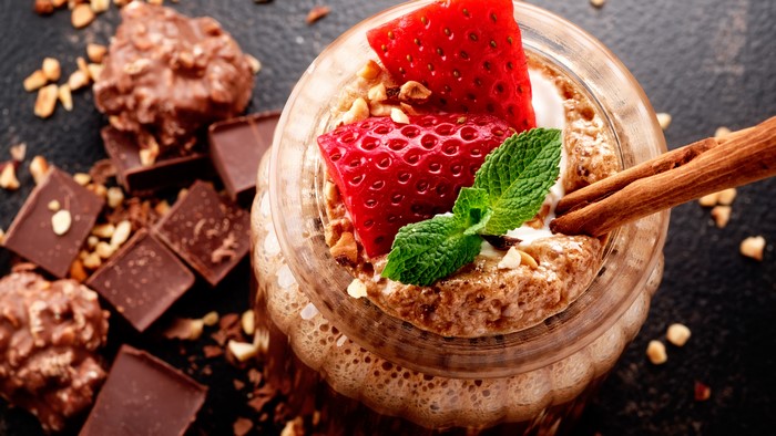 Chocolate strawberry dessert with nuts and cinnamon