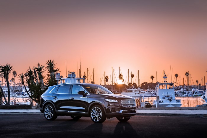 Black 2019 Lincoln Nautilus parked by a harbor at sunset