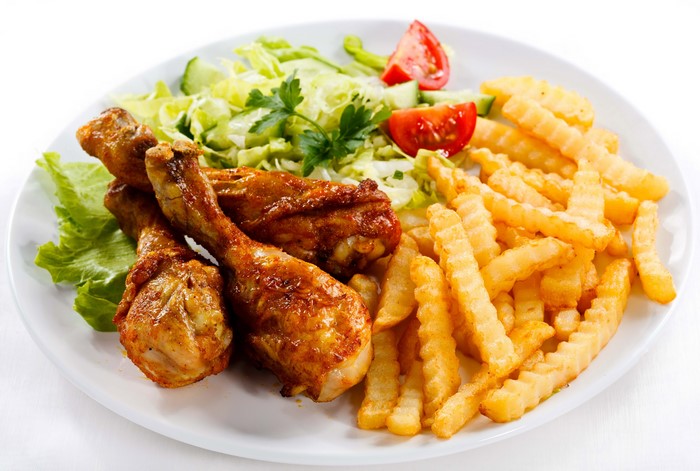 Roast Chicken with French Fries and Salad on a Plate