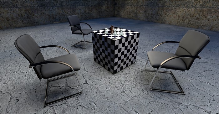 Chessboard cube table with chairs and chess pieces