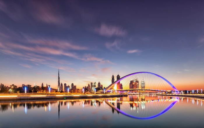 Dubai Skyline with Bridge and Canal at Dusk