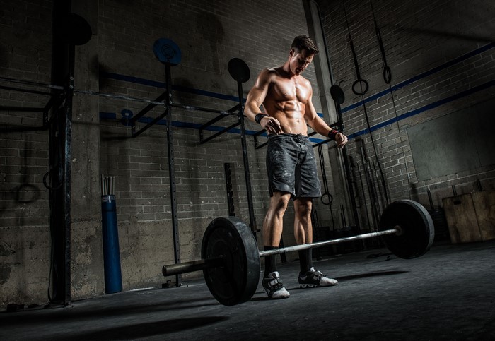 Man with Barbell in Gym
