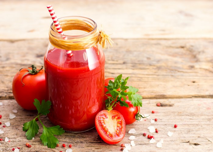Tomato Juice in a Jar with Tomatoes and Parsley