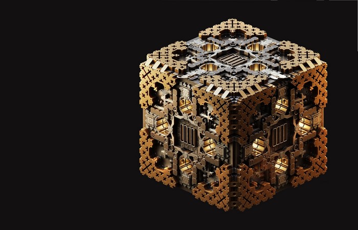 Intricate golden cube on a black background