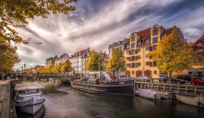 Copenhagen Canal in Autumn with Riverboat and Houses