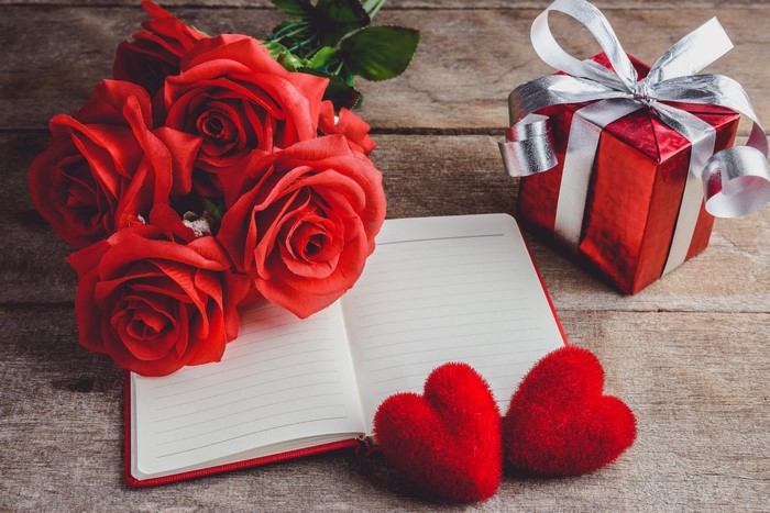 Red Roses, Gift, Notepad, and Hearts on Wood