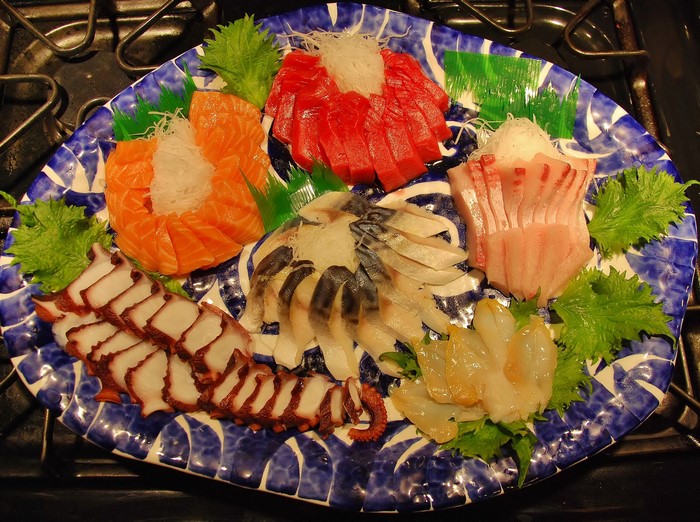 Assortment of fresh sashimi on a decorative plate