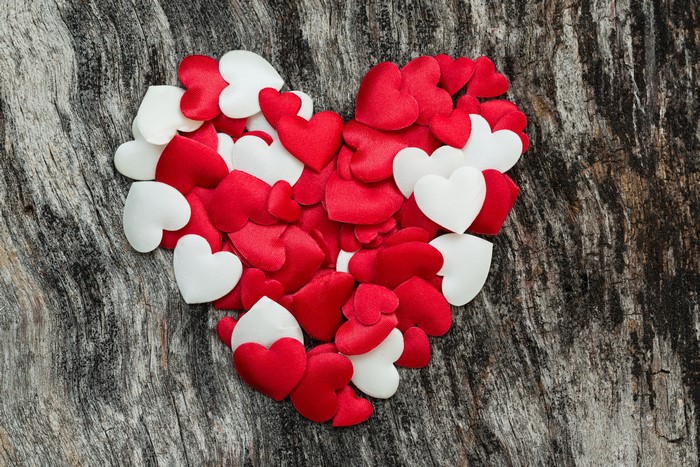 Red and white hearts on wood