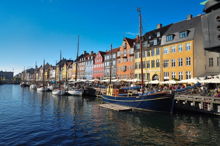 Nyhavn Canal in Copenhagen, Denmark with colorful buildings and boats