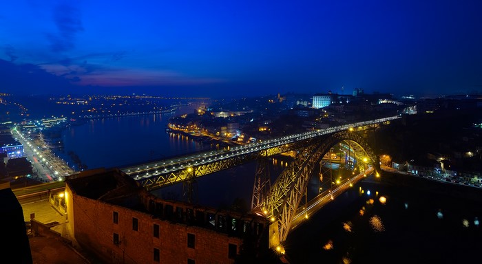 Dom Luís I Bridge over the Douro River at night in Porto, Portugal