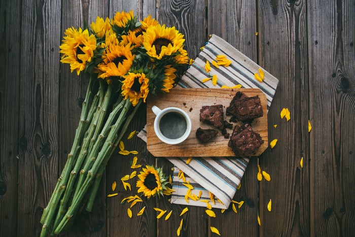 Sunflowers, Coffee, and Brownies on Wood