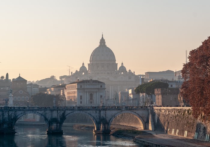 St. Peter's Basilica and Ponte Sant'Angelo in Rome at sunrise