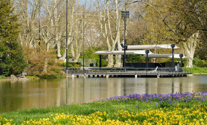 Park with pond, flowers, and outdoor seating area in Karlsruhe, Germany