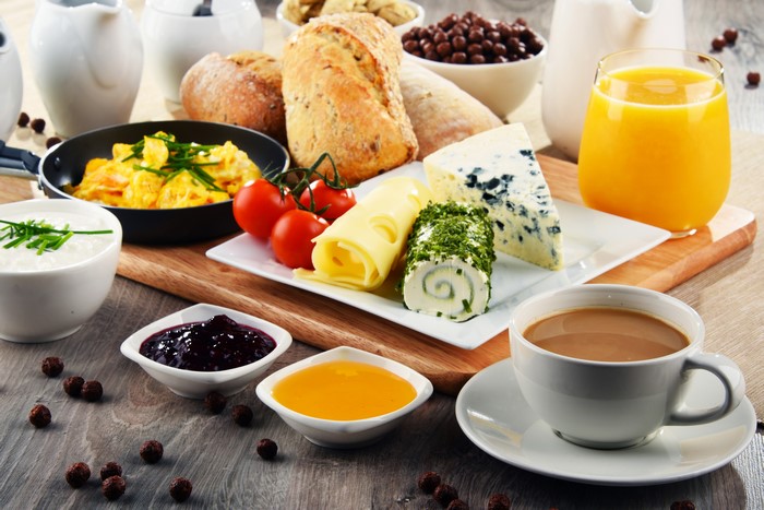 Breakfast with Coffee, Juice, Bread, Cheese, and Jam