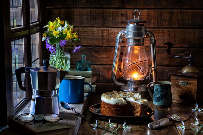 Still-life with cake, coffee, and flowers