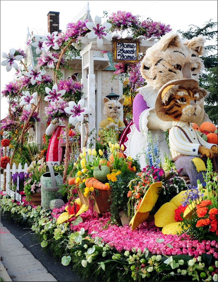 Rose Parade Float with Cat Characters and Flowers