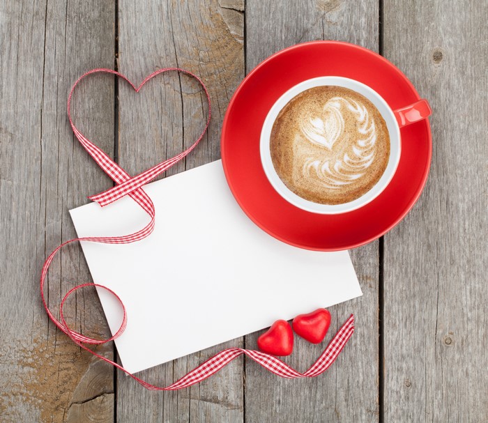 Valentine's Day coffee with heart ribbon and note