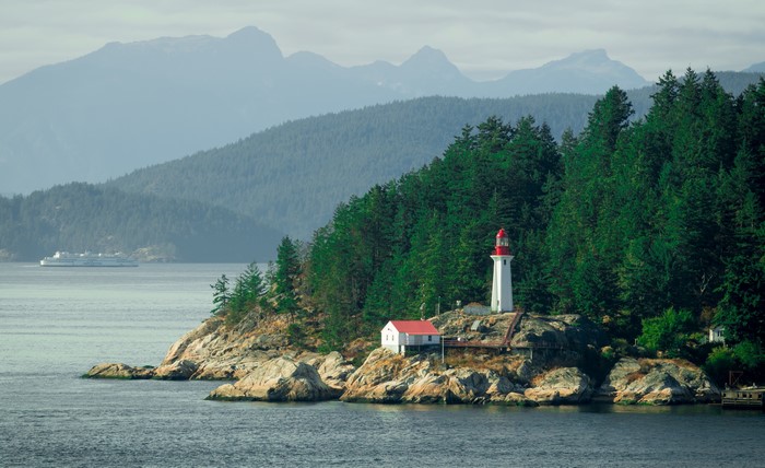 Lighthouse on rocky island in British Columbia, Canada