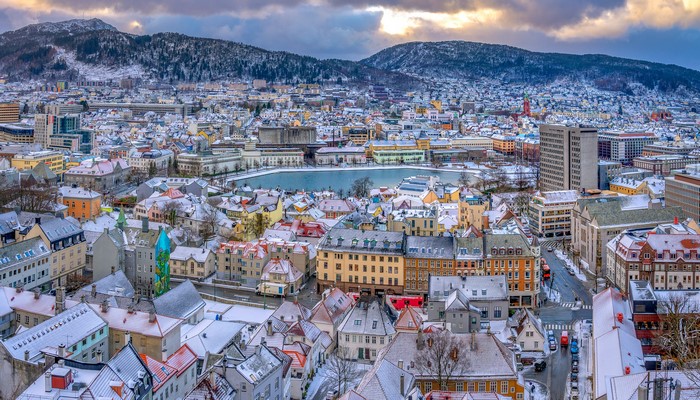 Bergen, Norway cityscape with snow-covered roofs and mountains
