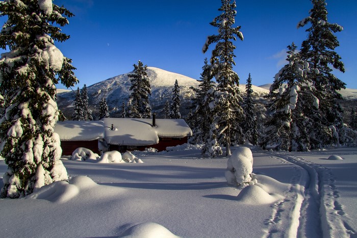 Snowy cabin and mountain in Norway