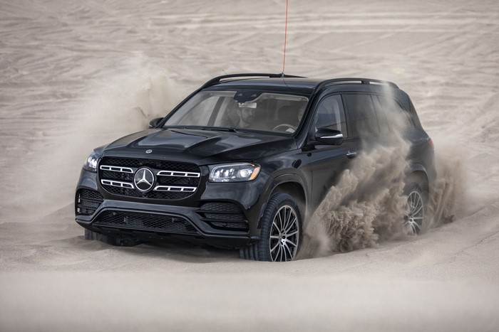 Black Mercedes-Benz GLS 580 4MATIC AMG Line driving in sand