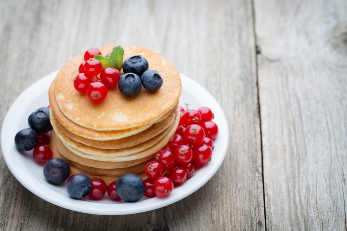 Pancakes with Blueberries and Currants on a Plate