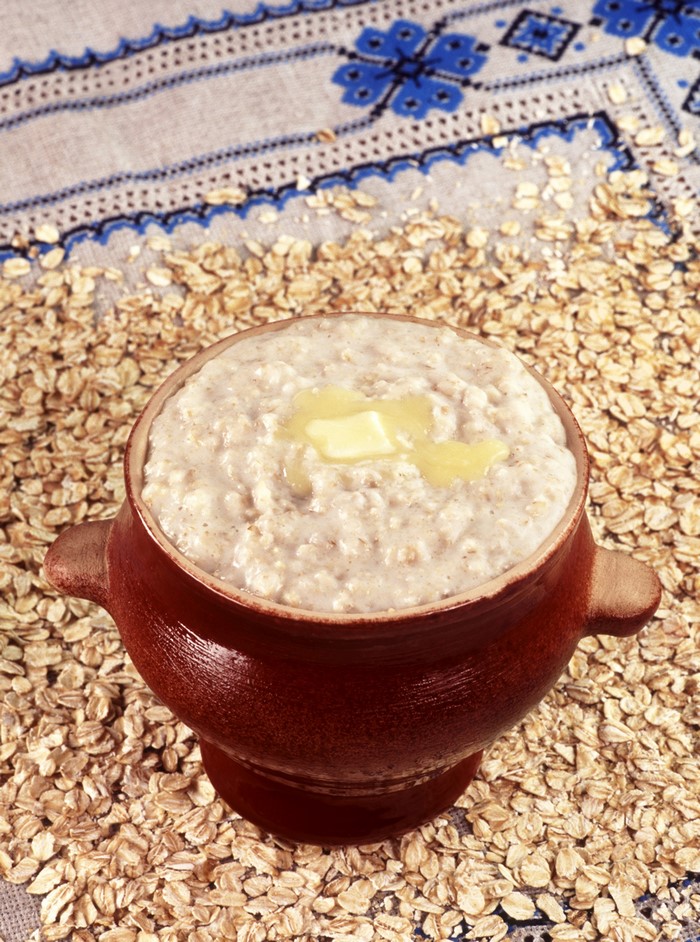 Oatmeal porridge with butter in a pot