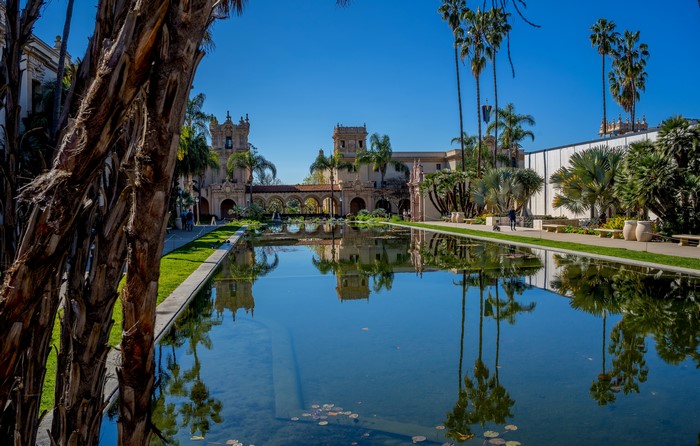 Balboa Park Pond with Spanish Colonial Architecture and Palm Trees