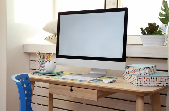Computer monitor, keyboard, and mouse on a desk