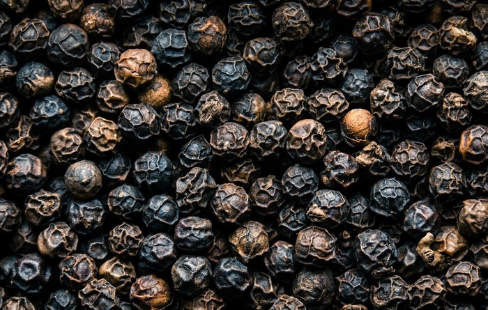 Close-up texture of black peppercorns