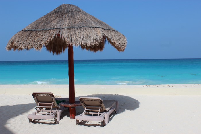 Beach with Palapa Umbrella and Sunloungers in Cancun, Mexico