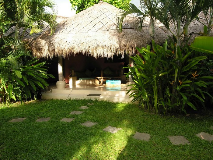 Villa Marakarita Bali Indonesia with thatched roof and garden