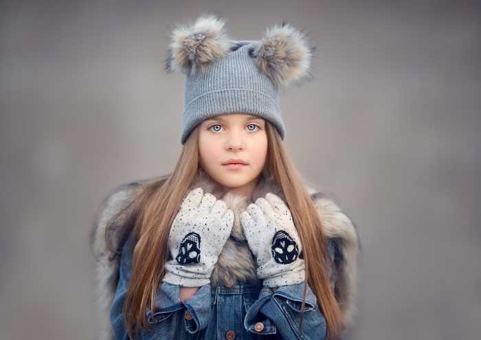 Young Girl in Winter Hat and Gloves