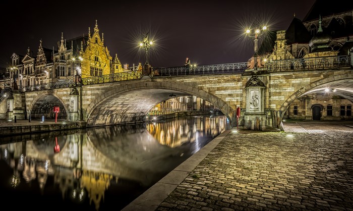 Night view of a bridge over a river in Belgium