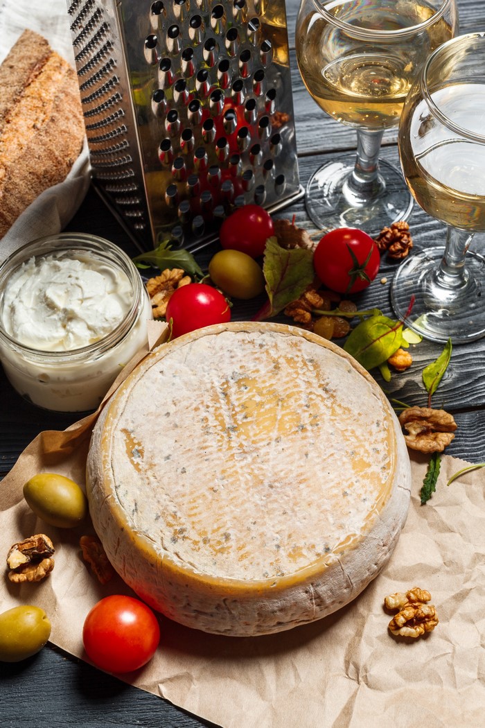 Cheese, Wine, Bread, Tomatoes, Nuts, and Olives