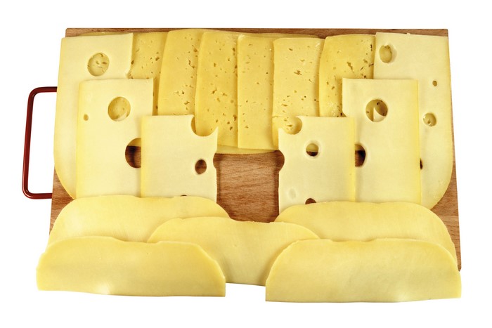 Cheese slices on a cutting board
