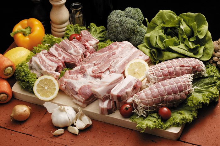 4K Meat products, Vegetables, and Pork on Cutting Board