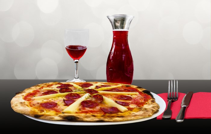 Pizza with Asparagus and Salami, Wine, and Cutlery