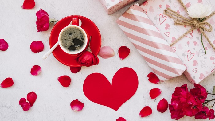 Valentine's Day coffee with gifts and rose petals