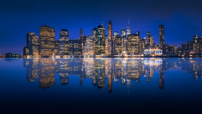 New York City skyline reflection at night