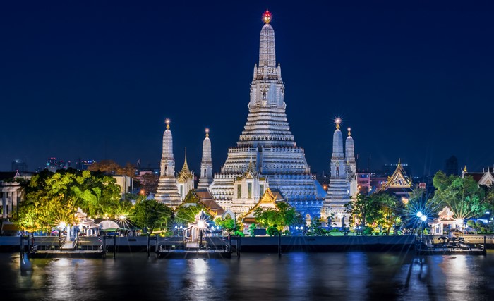 Wat Arun Temple at night on the Chao Phraya River, Bangkok