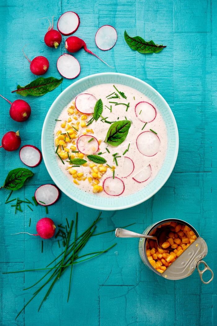 Creamy soup with corn, radishes, and chives
