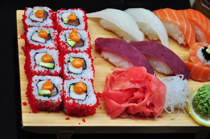 Sushi platter with various types of sushi and ginger