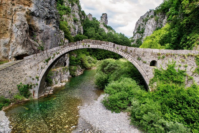 Stone arch bridge over a river in Ioannina, Greece