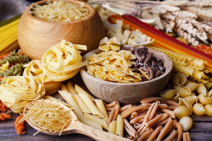 Assortment of Pasta in Bowls and Spoon