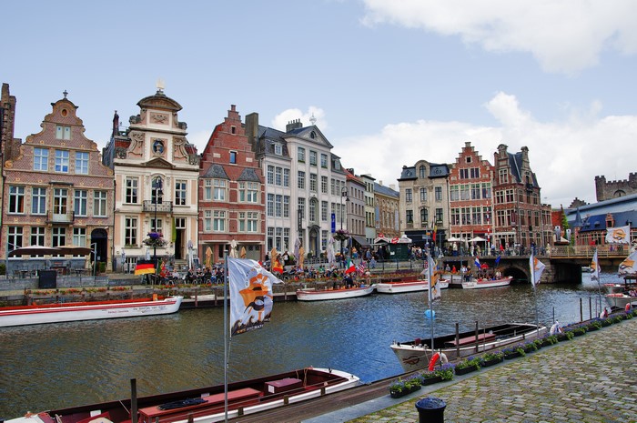 Ghent canal with historic houses and boats