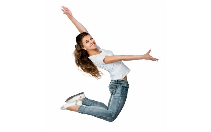 Woman in jeans and t-shirt jumping
