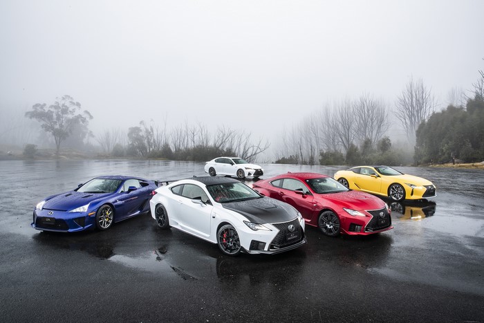 Lexus cars on a wet road in fog